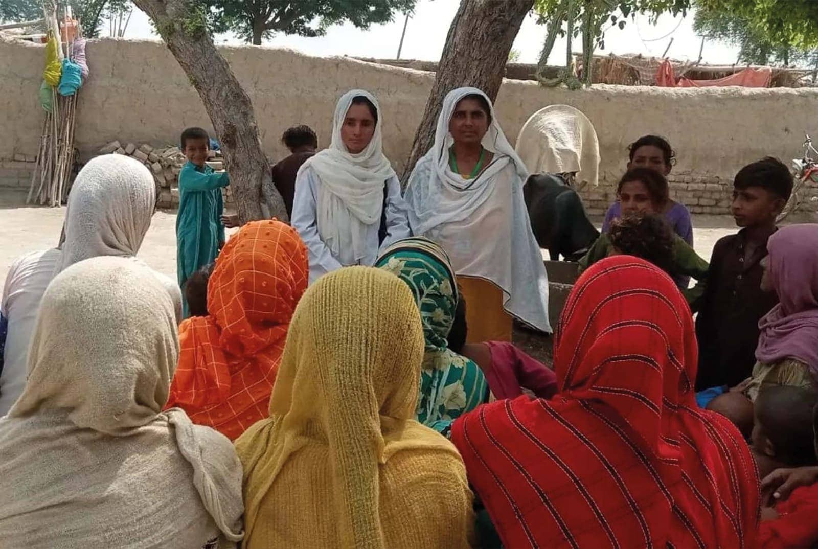 A community gathering in a Trust-supported village